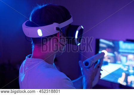 Man With Virtual Reality Headset And Joystic Is Playing Game
