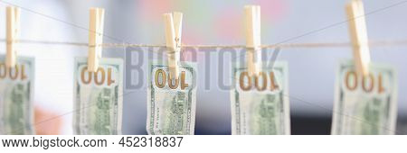 Close-up Of Banknotes Dry On Rope, Money Laundering, Dirty Cash, Washed Paper Bills. Cash Hang Out O