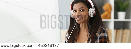 Portrait Of Pretty Young Office Worker In Headset, Making Notes, Search Information Online. Student 