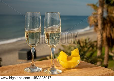 Outdoor Breakfast With Spanish Cava Sparkling Wine And Pineapple With View On Blue Sea And Sandy Bea