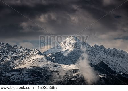 The Snow Capped Peak Of Monte San Parteo In The Balagne Region Of Corsica
