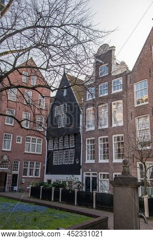 Amsterdam, Netherlands, March 2022. The Beguinage In Amsterdam With Historic Facades.