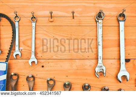 Auto Mechanic Tools Pegboard On The Wooden Wall Mount With Copy Space