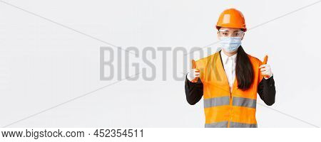 Covid-19 Safety Protocol At Enterpise, Construction And Preventing Virus Concept. Confident Female A