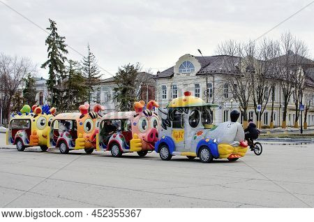 Engels, Russia- April 02, 2018: Attraction For Children In The City Park. Children's Train Rides Chi