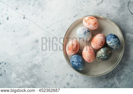 Easter Eggs. Dyed Easter Eggs With Marble Stone Effect Ref And Blue Color In Rustic Style On Light G