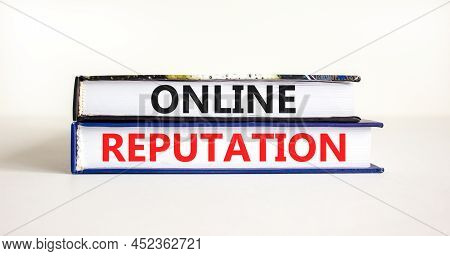 Online Reputation Symbol. Books With Concept Words Online Reputation On Beautiful White Background. 