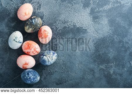 Easter Eggs. Dyed Easter Eggs With Marble Stone Effect Ref And Blue Color In Rustic Style On Dark St
