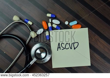 Ascvd Write On Sticky Notes Isolated On Wooden Table.