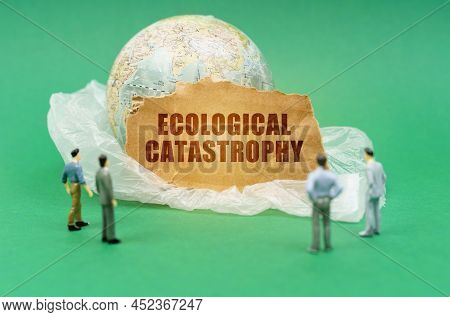 Ecological Concept. On A Green Background On A Plastic Bag Is A Globe And A Sign With The Inscriptio