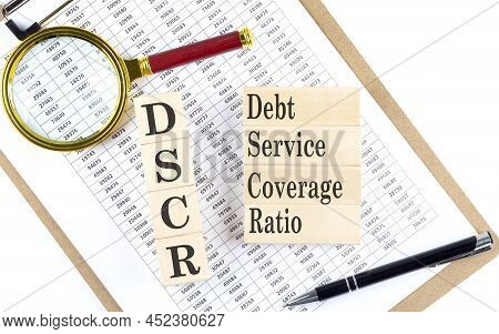 Dscr Text On A Wooden Block On Chart Background