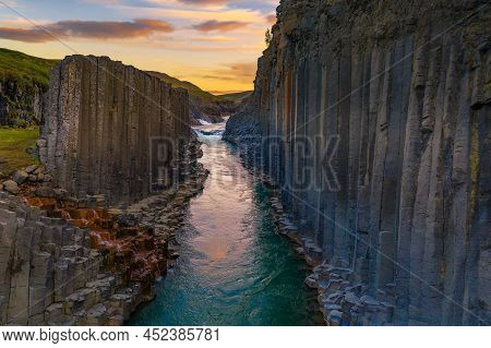 Studlagil Canyon With The Jokulsa A Bru River In East Iceland Photographed At Sunset.