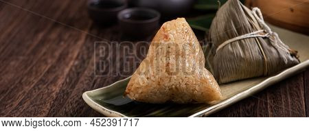 Zongzi. Rice Dumpling For Dragon Boat Festival On Dark Wooden Table Background.