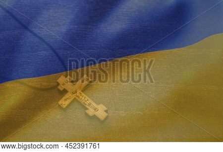 Cross On The Background Of The Ukrainian Flag. Pray For Ukraine, Flag Ukraine. Russia Vs Ukraine Sto