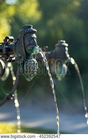 Close Up Old Winer Man Head With Grapes Founain In Eger Szepasszony Volgy Wine Region