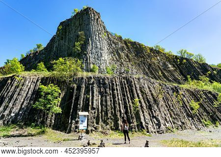 Hegyestu Geological Basalt Cliff In Kali Basin Hungary Near Koveskal With A Tourist Woman