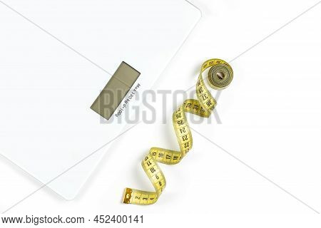 Modern Scales And Tape Measure Isolated On White, Top View.