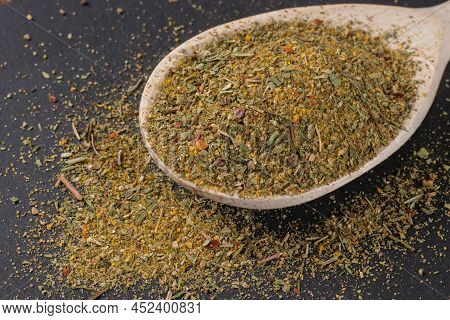 Close Up Image Of Khmeli-suneli In Wooden Spoon. Georgian Traditional Spices.