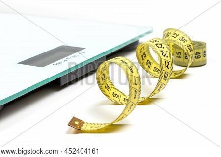 Modern Scales And Tape Measure Isolated On White