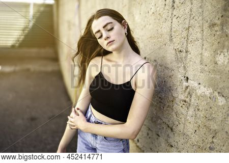 Nice And Cool Teen Girl Standing Portrait On Concreate Place