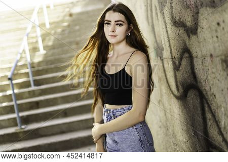 Nice And Cool Teen Girl Standing Portrait On Concreate Place