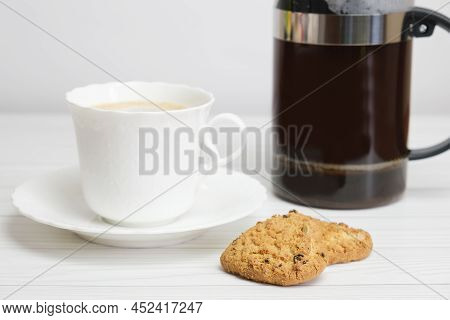 White Porcelain Cup With Coffee, French Press And Homemade Cookies. Homemade Cakes For Breakfast