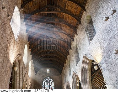 Shafts Of Sunlight Streaming Into The Interior Of Brecon Cathedral Church,brecon,powys,wales,uk.