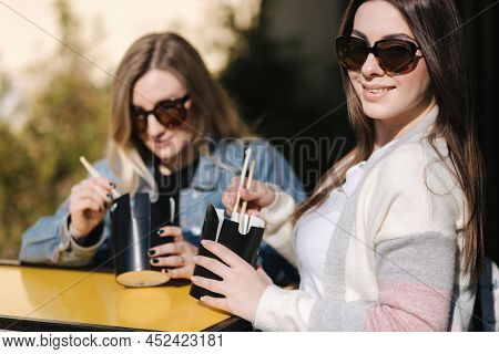 Delitious Lunch Of Takeaway Asian Food Outdoors. Best Friends Spend Time Together In Pring Sunny Day