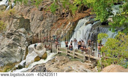 Hogenakkal,tamilnadu,india-march 19 2022: Tourists Taking Bath In Hogenakkal Falls. Hogenakkal Falls