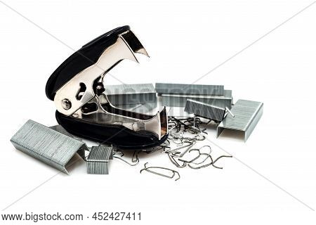Anti-stapler With Clerical Staples On A White Background. Stationery. Stapler