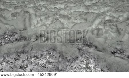 Winter Snow With Different Textures Ice On The Ground. Background, Substrate, Background In The Form