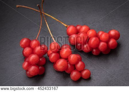 Berry Of The Five Flavors, Or Schisandra Chinesis Closeup, On Black Background, Nature , Health Eati