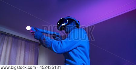 Man With Virtual Reality Headset And Joystic Is Playing Game