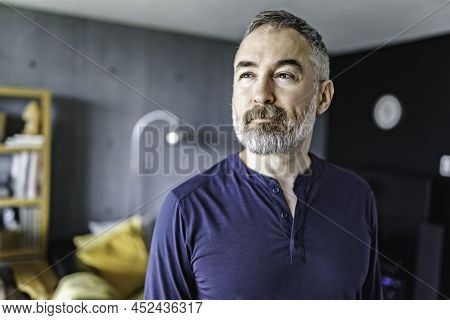Nice Joyful Mature Man At Home Appartement With Grey Beard