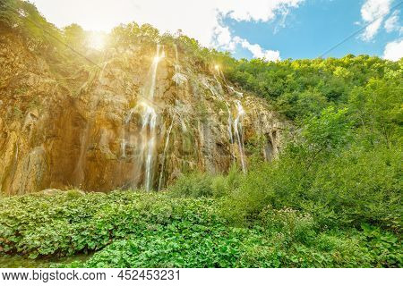 Sunshine On The Veliki Slap Waterfall Of Plitvice Lakes National Park In Croatia In The Lika Region.