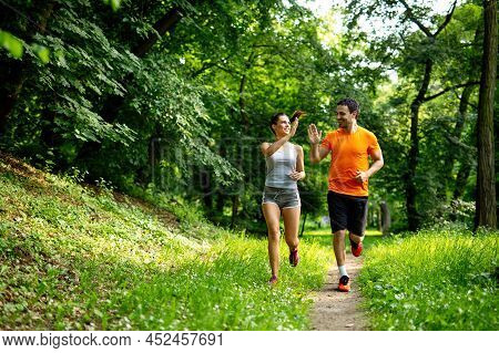 Portrait Of Happy Fit People Running Together Ourdoors. Couple Sport Healthy Lifetsyle Concept