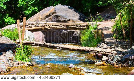Old Wooden Bridge And A Flow River In Imlil
