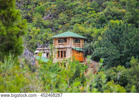 Wooden House Surrounded By Trees In Akchour In Morocco