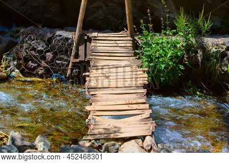 Old Wooden Bridge And A Flow River In Imlil Morocco