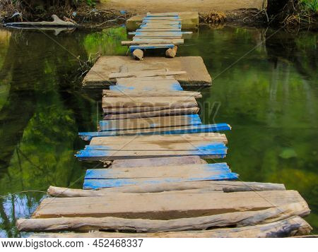 A Small Wooden Bridge Above Akchour River In Morocco