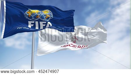 Doha, Qatar, January 2022: Flags With Fifa And Qatar 2022 World Cup Logo Waving In The Wind. The Eve