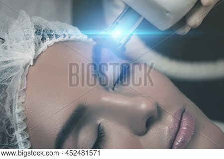 Beautiful Woman In Beauty Salon During Rejuvenation Procedure