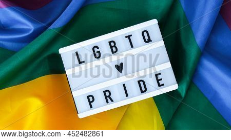Rainbow Flag With Lightbox And Text Lgbtq Pride. Rainbow Lgbtq Flag Made From Silk Material. Symbol 