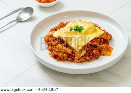 Kimchi Fried Rice With Pork And Topped Cheese