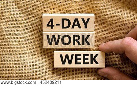 4-day Work Week Symbol. Concept Words 4-day Work Week On Wooden Blocks On Beautiful Canvas Backgroun