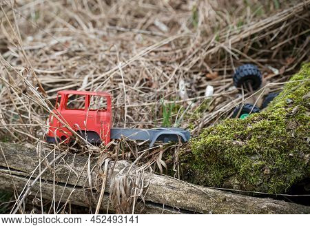 An Old Thrown Away Car, Toy Car In Nature, Probably Of Russian Origin.