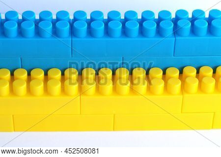 Background Ukraine Flag Brick Wall, Childish Cubes. Banner. Bright Toys With Stripes Concept Up Clos