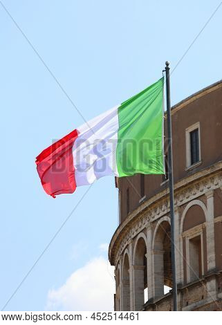 Big Italian Flag With Colors Red White And Green And Palace On Background