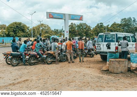 Jinka, Southern Nations Ethiopia - May 16, 2019: Young Ethiopian Men, Bikers, Waiting At A Gas Stati
