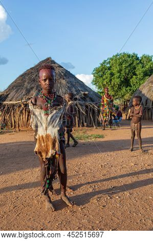 Turmi, Omo River Valley, Ethiopia - May 10, 2019: Portrait Of A Teenager In Hamar Village. Hamars Ar